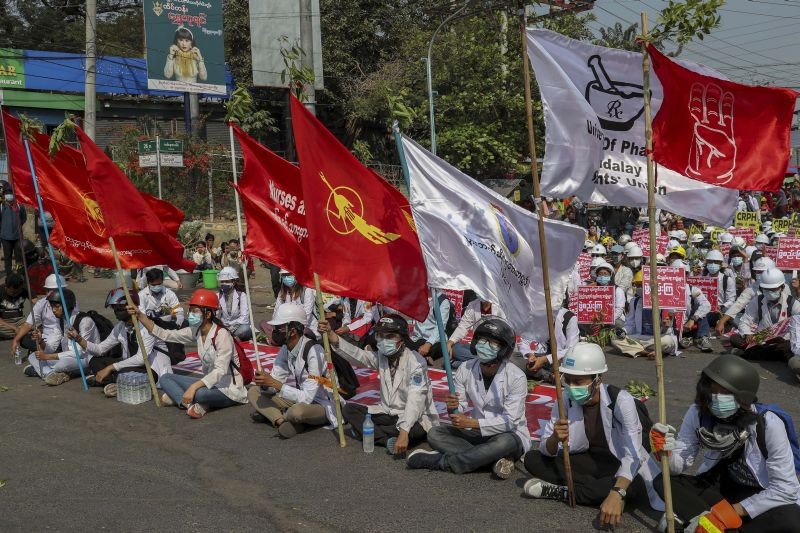 Medical students display flags of the National League for Democracy party during an anti-coup demonstration in Mandalay, Myanmar on March 4, 2021. Demonstrators in Myanmar protesting last month's military coup returned to the streets Thursday, undaunted by the killing of at least 38 people the previous day by security forces. (AP/PTI Photo)