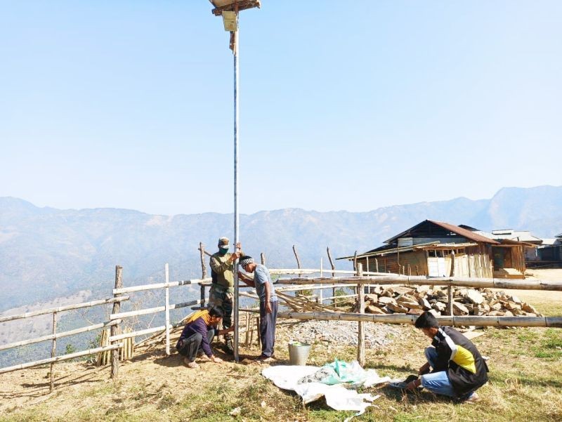 AR personnel under Kiphire Battalion install solar street lights at Mimi village on March 13. (Photo Courtesy: HQ IGAR North)