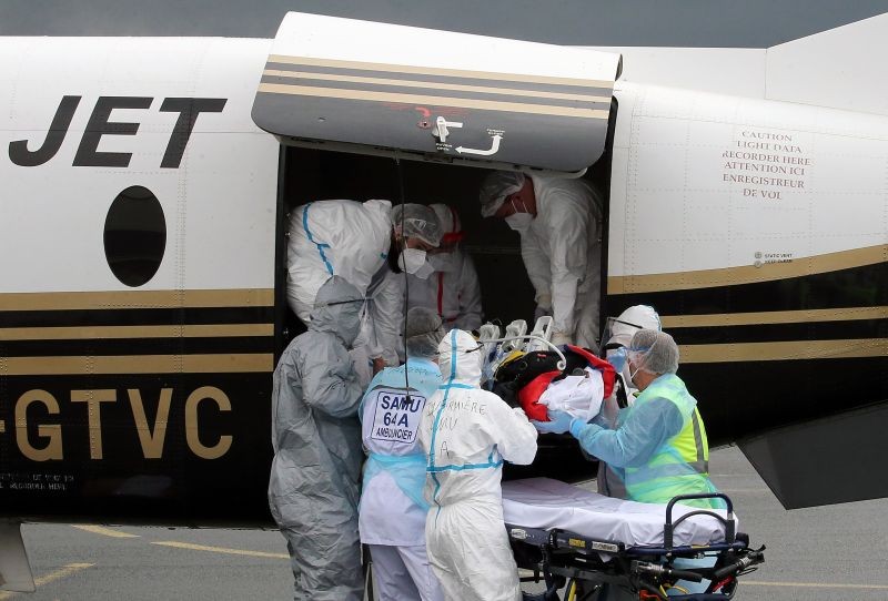 Biarritz: A patient from the Paris region and affected by the COVID-19 virus is taken out a plane at the Biarritz's airport, southwestern France, Friday, March19, 2021. The Paris region has an infection rate of 446 out of 100,000 inhabitants ‚Äî up more than 23% in a week, and intensive care units are close to saturation. AP/PTI