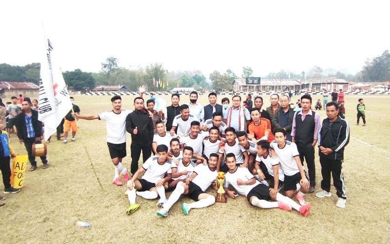 Nallong (White) FC along with DC Peren Sentiwapang Aier and others after lifting the 15th Jalukie Valley Open Football Trophy here at Jalukie B local ground on Monday evening.