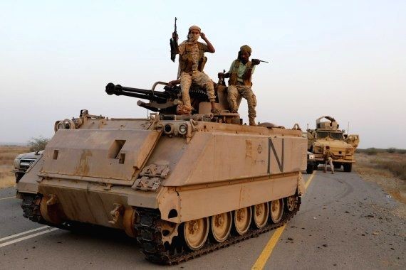 The picture taken on March 12, 2021 shows soldiers of the Yemeni government sitting on armored vehicles as they are launching an offensive against the Houthi rebels in Abs district, Hajjah Province, north Yemen. (IANS Photo)