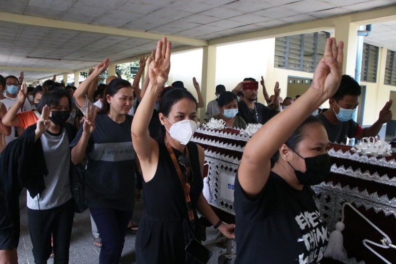 People carry the coffin of a woman who was killed during a clash with Myanmar's security forces, during her cremation in Yangon, Myanmar, Monday, March 29, 2021. (AP Photo)