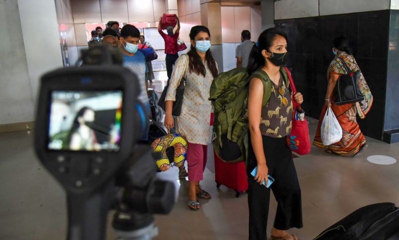 Guwahati: Passengers undergo digital scanning to check body temperature in view of COVID-19, at Guwahati Railway Station, Thursday, April 8, 2021. (PTI Photo)