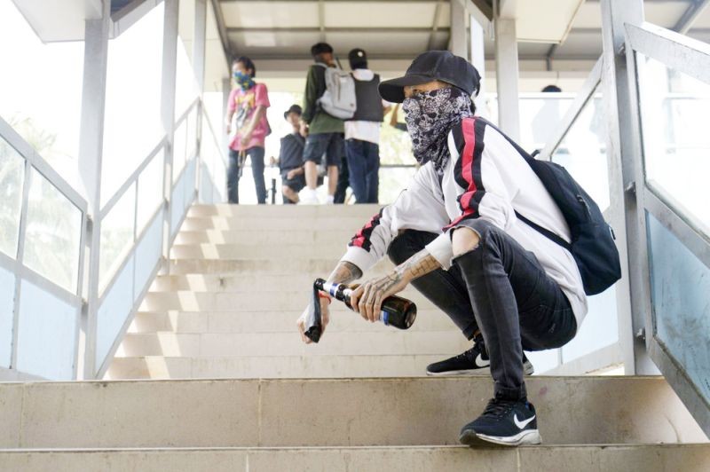 A pro-democracy protester holds a molotov cocktail during a protest in Yangon, Myanmar on April 3. (AP Photo)