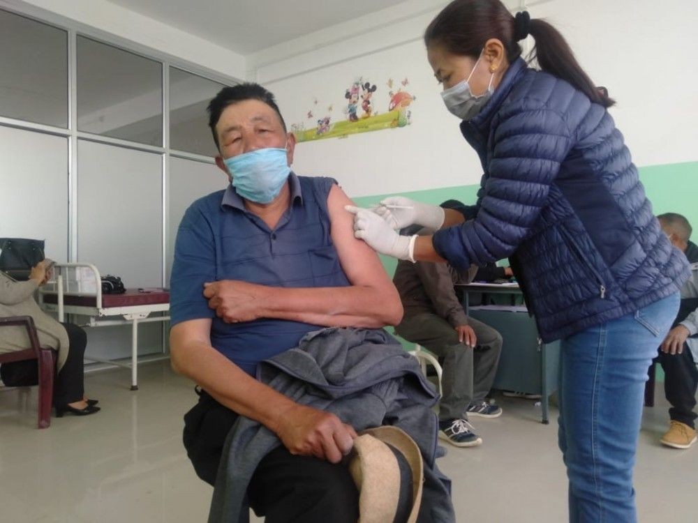 A senior citizen receives the first dose of COVID vaccine in Phek. Phek launched the second phase of COVID-19 vaccination for age-appropriate groups on March 1. (Photo Courtesy: CMO office Phek)