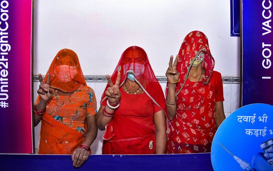 Womens pose for the photos after  receiving the dose of COVID-19 vaccine in Bikaner on April 11.(PTI Photo)