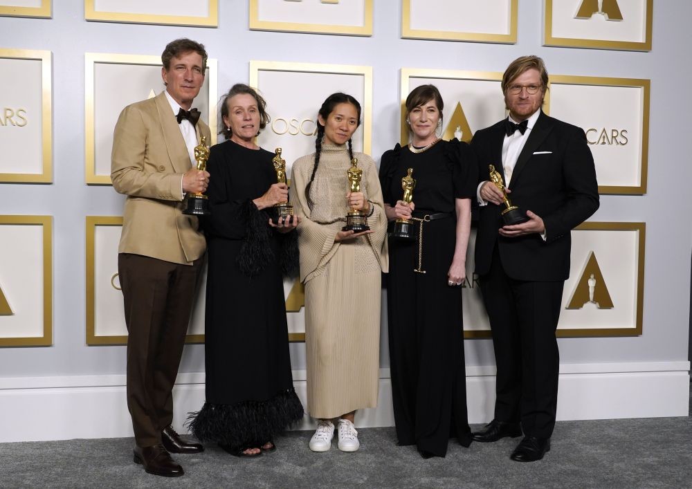 Los Angeles: Producers Peter Spears, from left, Frances McDormand, Chloe Zhao, Mollye Asher and Dan Janvey, winners of the award for best picture for "Nomadland," pose in the press room at the Oscars on Sunday, April 25, 2021, at Union Station in Los Angeles. AP/PTI Photo