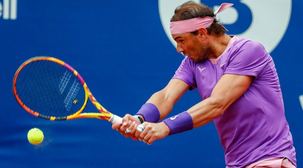 Rafael Nadal of Spain returns the ball. (AP Photo)