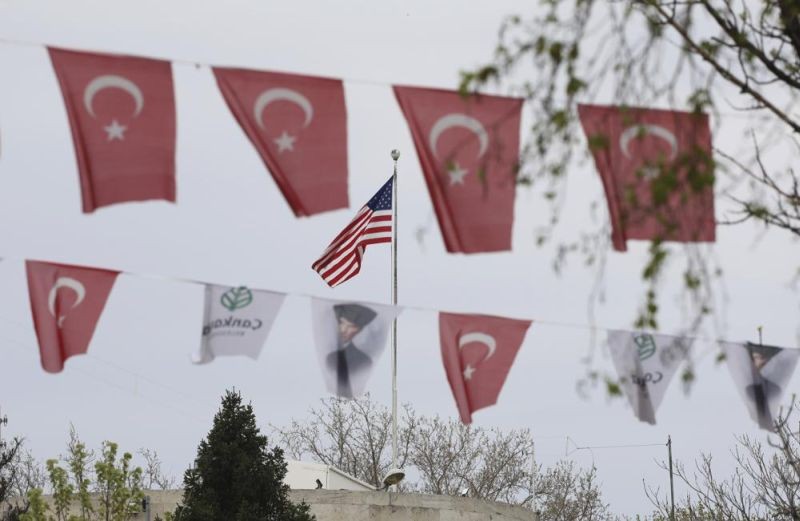 Turkish flags and banners depicting Mustafa Kemal Ataturk, the founder of modern Turkey, decorate a street outside the United States embassy in Ankara, Turkey, Sunday, April 25, 2021.  (AP Photo)