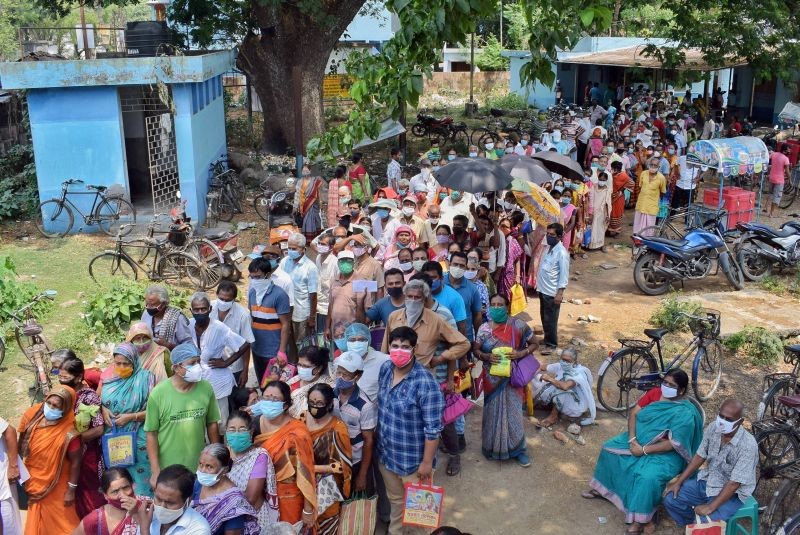 People gather in large numbers to receive Corona Vaxination outside of a government hospital in Nadia, West Bengal on April 26. (PTI Photo)