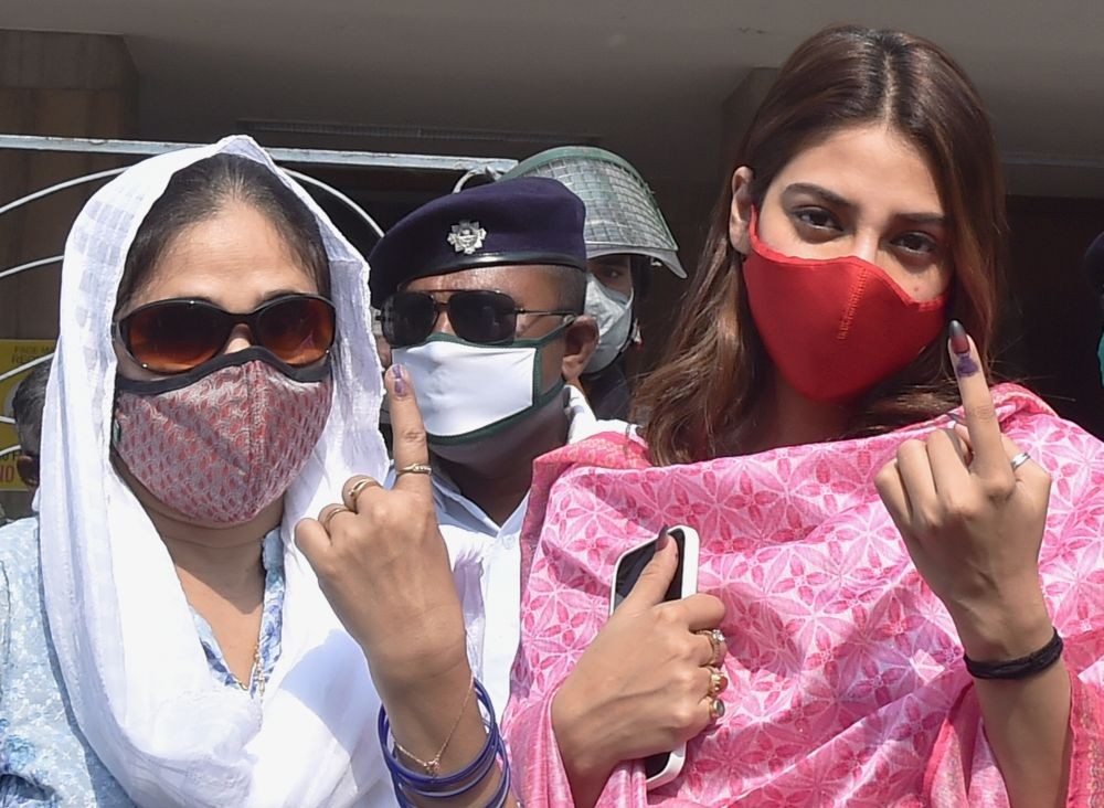 Kolkata: TMC MP Nusrat Jahan (R) with her mother shows her finger marked with indelible ink after casting her vote during the 7th phase of the West Bengal State Assembly polls, at a polling station, in Kolkata, Monday, April 26, 2021. (PTI Photo/Swapan Mahapatra)