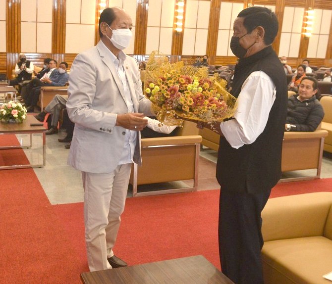 Nagaland CM Neiphiu Rio felicitates H Chuba Chang during the programme held at State Banquet Hall Chief Minister's residential complex in Kohima on April 6.