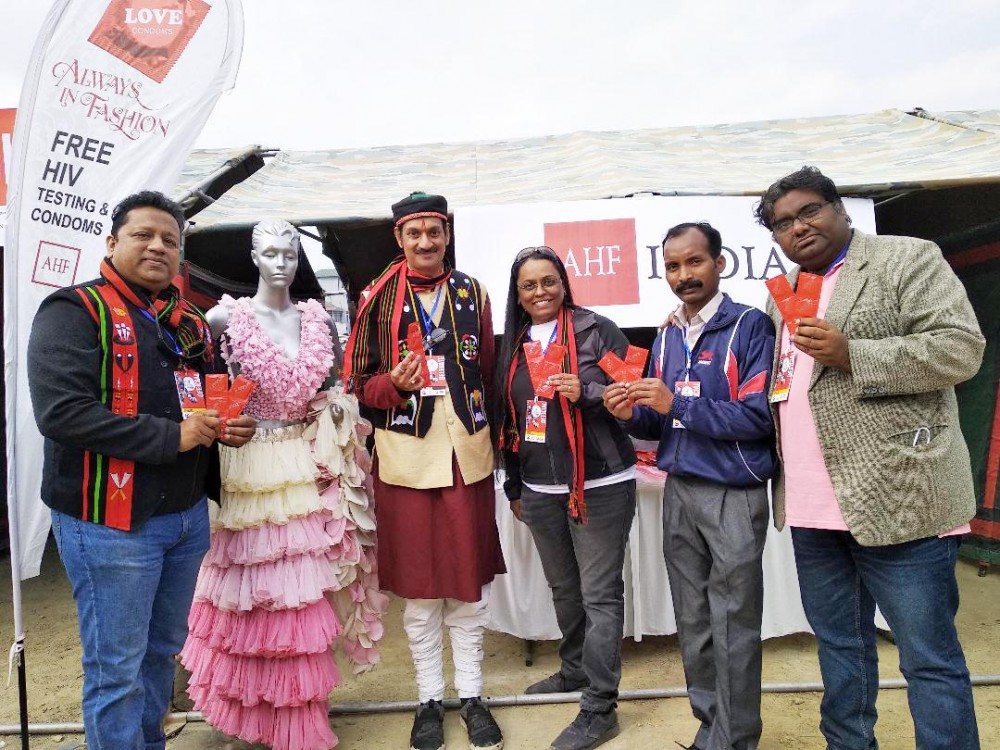 Dr. V. Sam Prasad, Country Program Director, AHF (Left) with the AHF Team in Kohima. The mannequin is adorned with a garment made of condoms. (Morung Photo)