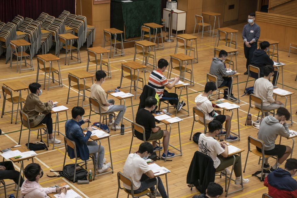 Hong Kong: Students sit for the Diploma of Secondary Education (DSE) exams Monday, April 26, 2021 in Hong Kong. Temperature checks and social distancing measures to avoid the spread of COVID-19 have been put in place in the schools for over 50,000 candidates who will sit for the DSE examination this year AP/PTI Phot