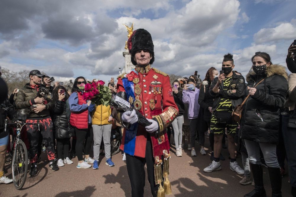 London: A man arrives to lay a floral tribute outside Buckingham Palace, London, following the announcement of the death of the Britain's Prince Philip at the age of 99. Prince Philip, the irascible and tough-minded husband of Queen Elizabeth II who spent more than seven decades supporting his wife in a role that both defined and constricted his life, has died, Buckingham Palace said Friday. He was 99. AP/PTI