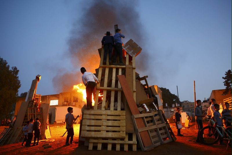 Ultra-Orthodox Jews light a bonfire during the Jewish holiday of Lag Ba'Omer celebration in Bnei Brak, Israel, Thursday, April 29, 2021. The holiday marking the end of a plague said to have decimated Jews during the Roman times. (AP/PTI Photo)