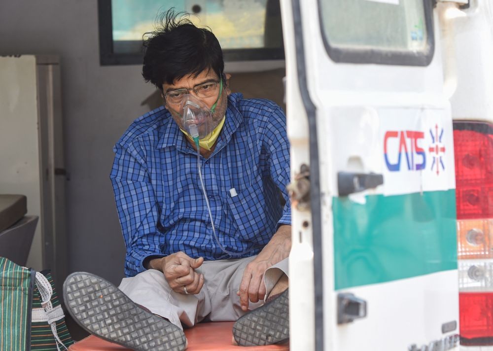 New Delhi: A COVID-19 patient waits in an ambulance outside the LNJP hospital, in New Delhi, Monday, April 26, 2021. (PTI Photo/Manvender Vashist)