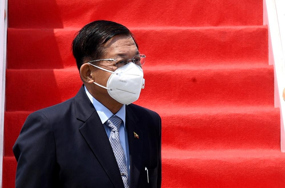 In this photo released by Indonesian Presidential Palace, Myanmar's Senior General Min Aung Hlaing, left, arrives at Soekarno-Hatta International Airport in Tangerang on the outskirts of Jakarta, Indonesia, Saturday, April 24, 2021. Southeast Asian leaders are to meet Myanmar's top general and coup leader in an emergency summit in Indonesia Saturday, and are expected to press calls for an end to violence by security forces that has left hundreds of protesters dead as well as the release of Aung San Suu Kyi and other political detainees. (Rusman/Indonesian Presidential Palace via AP)