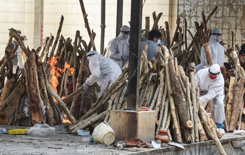 Mass cremation of COVID-19 victims and others takes place at Cremation Ground Madan Puri, in Gurugram on April 29. (PTI Photo)