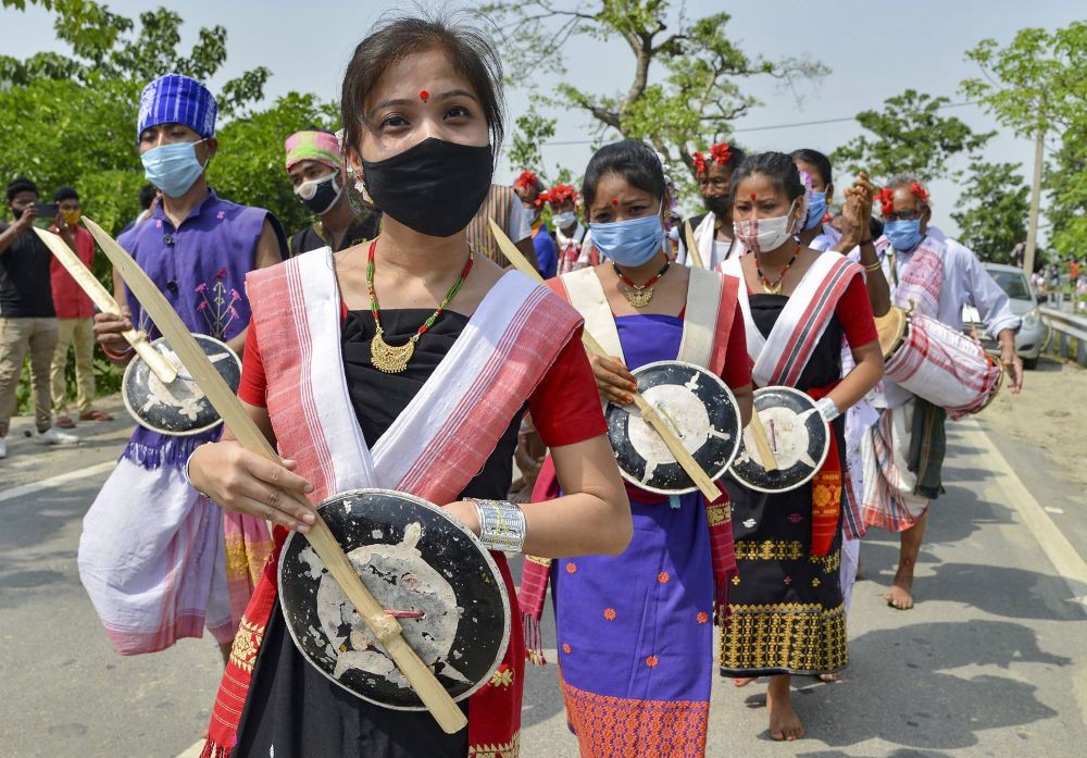 Mayong: Karbi tribesmen and women take part in a religious procession during the traditional 'Gohain Uliuwa Mela' festival at Mayong village in Morigaon district, Tuesday, April 20, 2021. Mayong is considered as the 'land of black magic and witchcraft.' (PTI Photo)