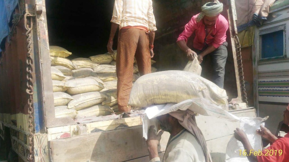 Labourers unloading the cements from the truck for distribution to the 11 wards chairmen for the construction of drainage and footsteps in Kiphire Town under grant-in-aid programme. (Morung Photo)
