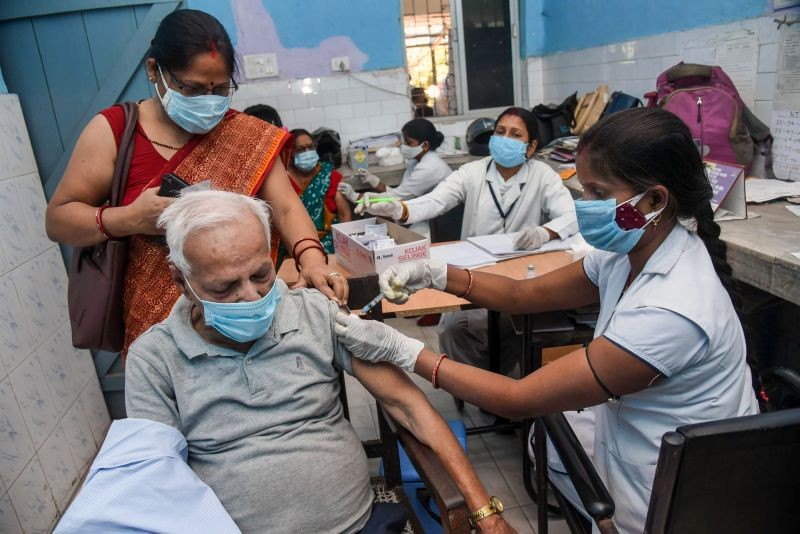 A beneficiary receive the first dose of COVID-19 vaccine, at a government dispensary, in Patna on April. 13,2021. (PTI Photo)
