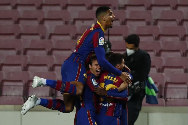 Barcelona : Barcelona's Ousmane Dembele, right, celebrates with his teammates after scoring his side's opening goal during the Spanish La Liga soccer match between FC Barcelona and Valladolid CF at the Camp Nou stadium in Barcelona, Spain, Monday, April 5, 2021. AP/PTI