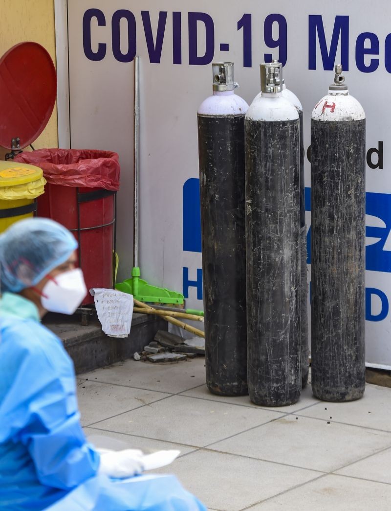 Oxygen cylinders outside the Shehnai Banquet Hall, a Covid Care Centre, as coronavirus cases surge in record numbers across the country, in New Delhi on April 29, 2021. (PTI Photo)