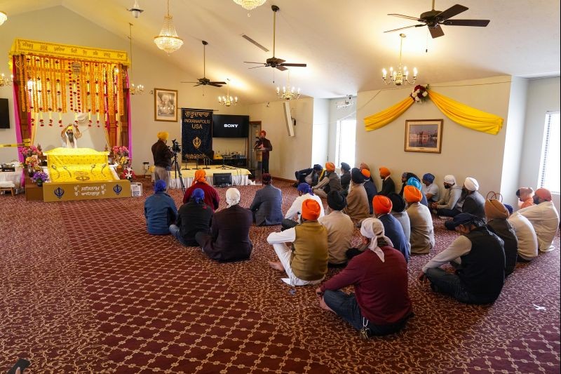 Members of the Sikh Coalition gather at the Sikh Satsang of Indianapolis in Indianapolis on April 17, 2021 to formulate the groups response to the shooting at a FedEx facility in Indianapolis that claimed the lives of four members of the Sikh community.  A gunman killed eight people and wounded several others before  taking his own life in a late-night attack at a FedEx facility near the Indianapolis airport. (AP/PTI Photo)