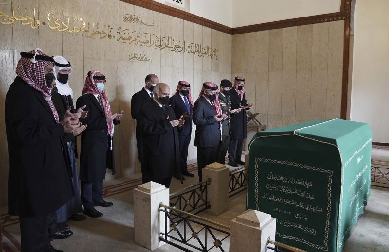 This photo from the Royal Court twitter account, shows Jordan's‚ King Abdullah II, third right, Prince Hassan bin Talal, fifth right, Prince Hamzah bin Al Hussein, seventh right, and others pray during a visit to the tomb of the late King Abdullah I, in Amman Jordan on April 11, 2021. King Abdullah II and his half brother Prince Hamzah have made their first joint public appearance since a palace feud last week. Members of the Jordanian royal family Sunday marked the centenary of the establishment of the Emirate of Transjordan, a British protectorate that preceded the kingdom. (AP/PTI Photo)