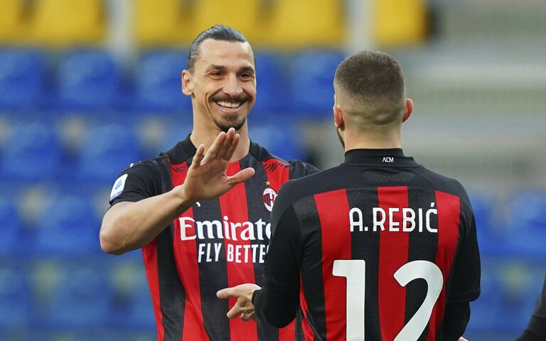 Milan’s Ante Rebic celebrates after scoring his side’s first goal, with teammate Zlatan Ibrahimovic, who gave him the assist, during the Italian Serie A soccer... (Spada/LaPresse via AP)