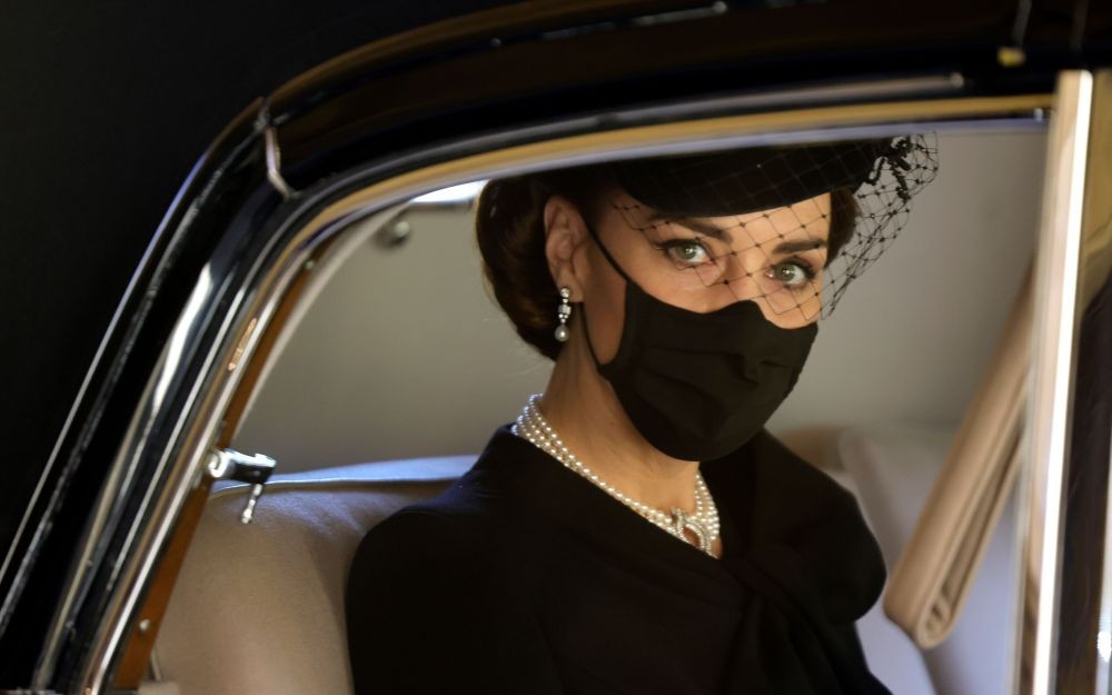 Kate, Duchess of Cambridge looks out from a car window as she arrives for the funeral of Britain's Prince Philip inside Windsor Castle in Windsor, England, Saturday, April 17, 2021. Prince Philip died April 9 at the age of 99 after 73 years of marriage to Britain's Queen Elizabeth II. (Photo by Chris Jackson/Pool via AP Photo)