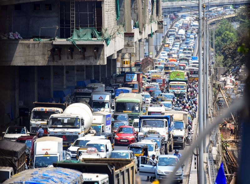 Heavy traffic on Western Express highway, after Police personnel put barricades to stop commuters, following the restrictions imposed by the Maharashtra Government to curb the Covid-19 spread at Malad, in Mumbai ON April 15, 2021. (PTI Photo)