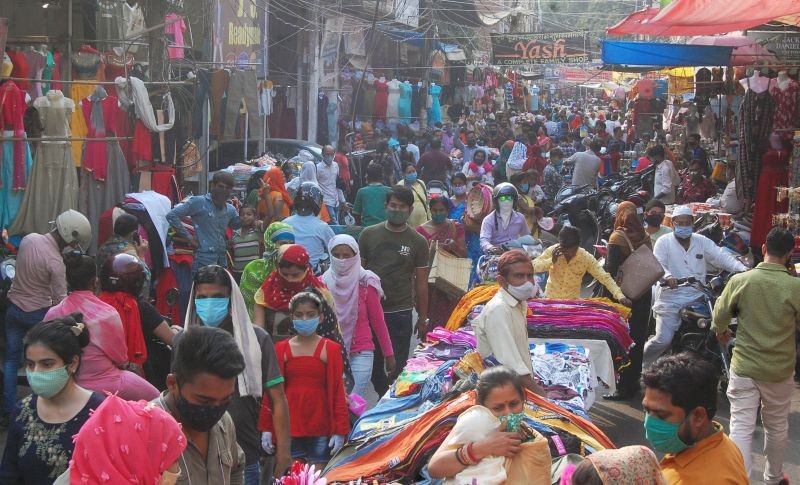Kanpur: People gather at a market area, amid the ongoing surge in coronavirus cases, in Kanpur, Friday, April 16, 2021. (PTI Photo)