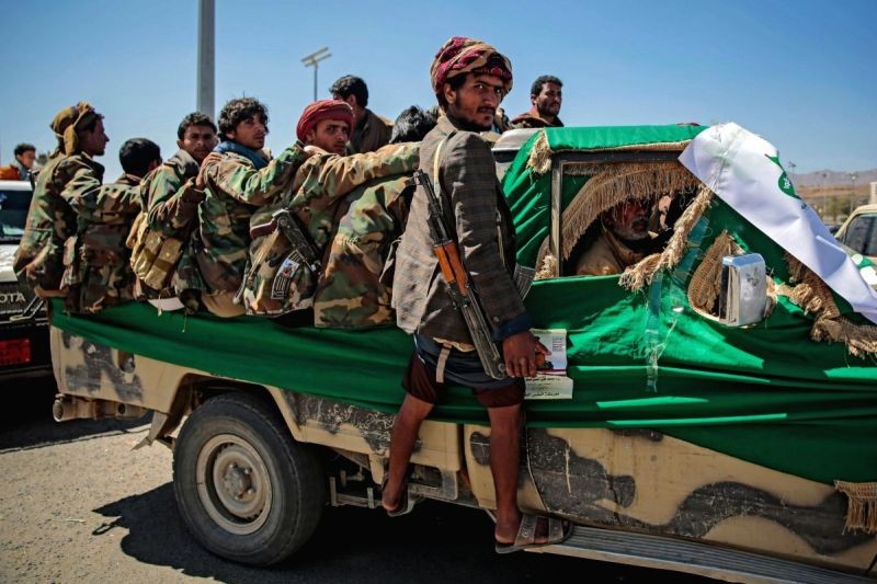 Armed members of the Houthi rebel movement ride a vehicle during a funeral procession on March 9. (IANS File Photo)
