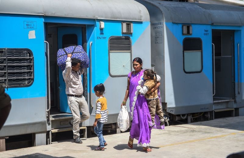 Passengers, not wearing mask, seen at Aishbagh railway station amid surge in Covid-19 cases across country in Lucknow on April 11, 2021. (PTI Photo)