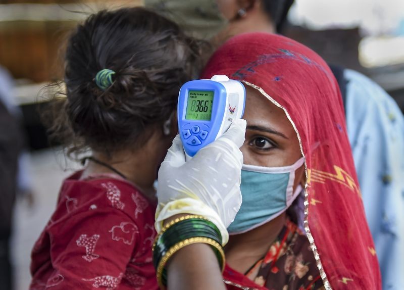 Mumbai: A BMC health worker does the screening of a passenger for COVID-19 test, at a railway station in Mumbai, Thursday, May 27, 2021.  (PTI Photo/Kunal Patil)