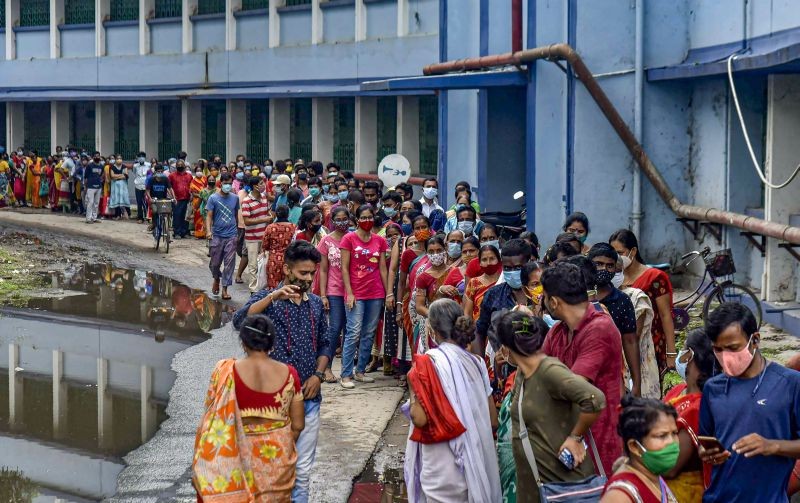 Beneficiaries wait to receive a dose of COVID-19 vaccine, at a district government hospital, Balurghat in South Dinajpur on May 31, 2021. (PTI Photo)