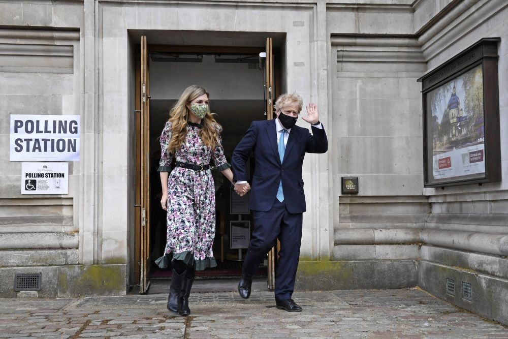 London : Prime Minister Boris Johnson, right, and his fiancee Carrie Symonds leave after casting their vote at Methodist Central Hall, central London, Thursday May 6, 2021. Millions of people across Britain will cast a ballot on Thursday, in local elections, the biggest set of votes since the 2019 general election, including Londoners who will elect a mayor whose performance will help determine whether this is a period of decline for Europe‚Äôs biggest city. AP/PTI