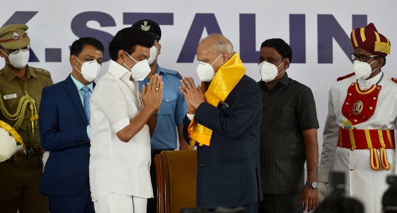 Newly sworn-in Tamil Nadu Chief Minister Muthuvel Karunanidhi Stalin exchanges greetings with Governor Banwari Lal Purohit, during his swearing-in ceremony at Rajbhavan, in Chennai on May 7, 2021. (PTI Photo)