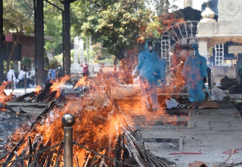 Cremation of COVID-19 victims at Nigambodh Ghat cremation ground as coronavirus cases surge in New Delhi on May 9, 2021. (PTI Photo)