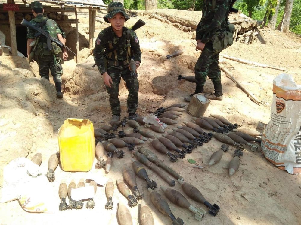 Mutraw : In this photo provided by Karen National Liberation Army, a Karen National Liberation Army soldier holds a motor shell while standing next to a cache of mortar shells found at a Myanmar military outpost Friday, May 7, 2021, in Mutraw district, Karen State, Myanmar. Ethnic Karen guerrillas burned down a Myanmar military outpost Friday morning, capturing it without a fight after its garrison fled at their approach, a senior Karen officer said.  AP/PTI(