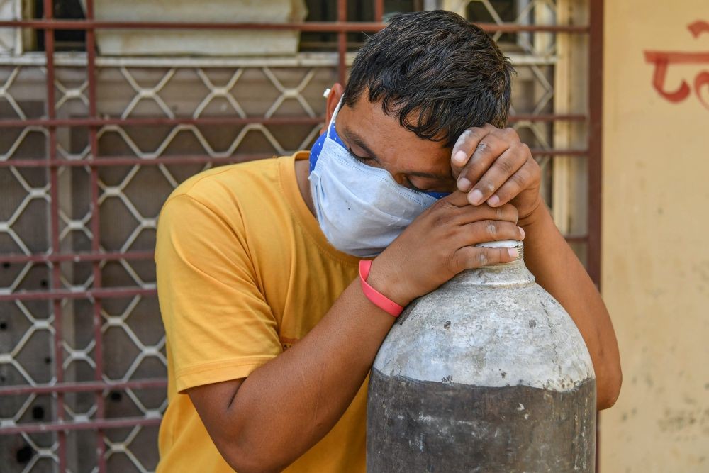 Ajmer: A family member of a COVID-19 patient rests as he waits to refill a cylinder with medical oxygen, in Ajmer, Thursday, May 6, 2021. (PTI Photo)