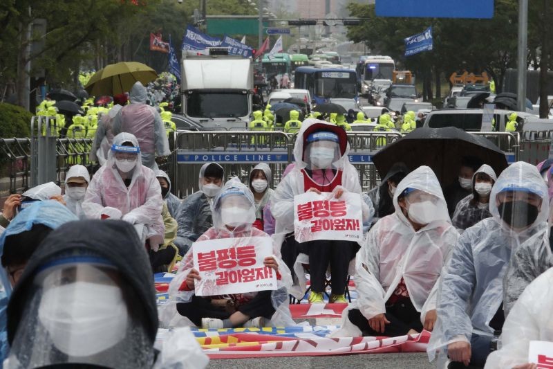 Members of the Korean Confederation of Trade Unions stage a May Day rally demanding better working conditions and expanding labor rights in Seoul, South Korea on May 1. The signs read: "Let's solve inequality." (AP/PTI Photo)