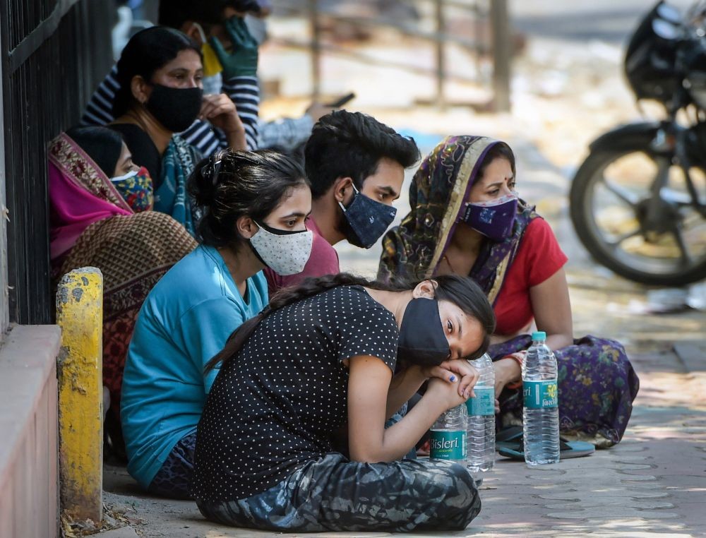 New Delhi: Relatives mourns after the death of family member due to COVID-19, as coronavirus cases surge in the national capital , at LNJP Hospital ,in New Delhi, Sunday, May 9, 2021. (PTI Photo/Manvender Vashist)