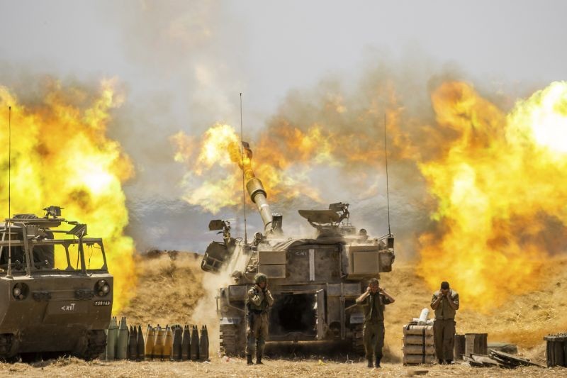 Israel Gaza border:An Israeli artillery unit fires toward targets in Gaza Strip, at the Israeli Gaza border on May 12, 2021. (AP/PTI Photo)