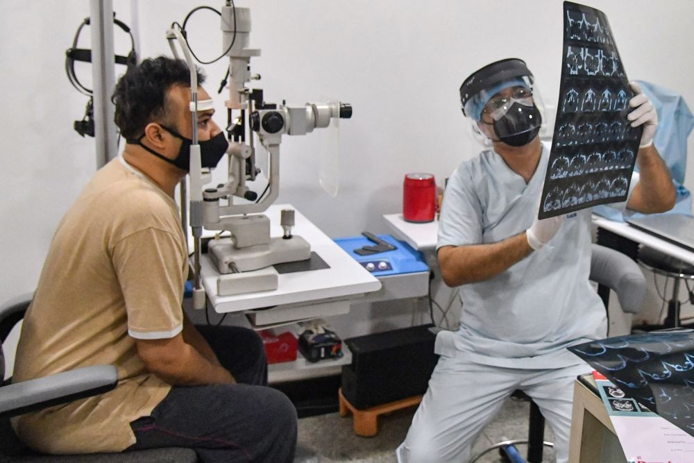 Ajmer: A doctor attends to a patient suspected to have been infected with mucormycosis, at a hospital in Ajmer, Wednesday, May 26, 2021. (PTI Photo)