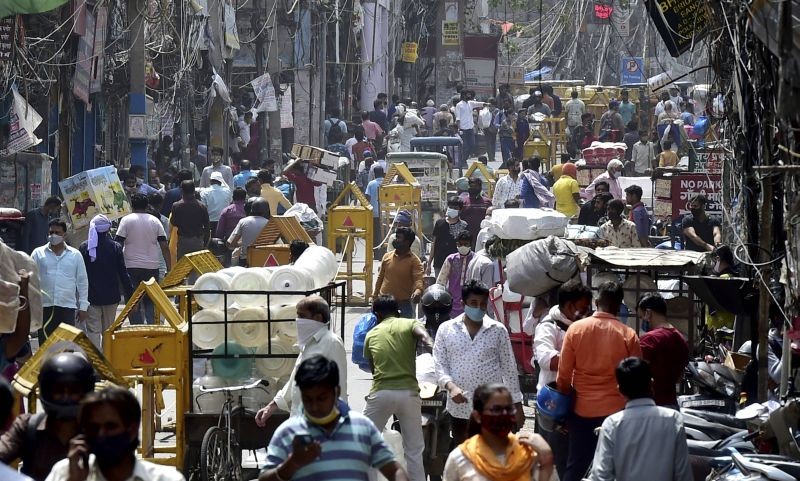 People crowd at Sadar Bazar as shops reopened after the unlocking process of COVID-19 lockdown began in a phased manner, in New Delhi on June 8. (PTI Photo)