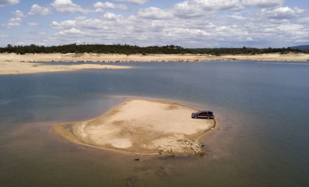 Granite Bay : William Heinz parks his vehicle on a newly revealed piece of land due to receding waters at the drought-stricken Folsom Lake in Granite Bay, Calif., Saturday, May 22, 2021. California Gov. Gavin Newsom declared a drought emergency for most of the state. AP/PTI