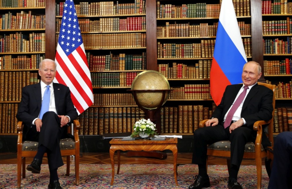 U.S. President Joe Biden, left, and Russia's President Vladimir Putin, right, meet at the start of the U.S.-Russia summit at Villa La Grange in Geneva, Switzerland, Wednesday, June 16, 2021. (Denis Balibouse/Pool Photo via AP)